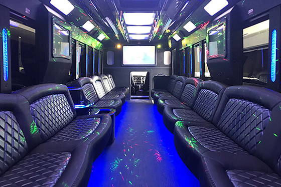 limo bus with a large TV
