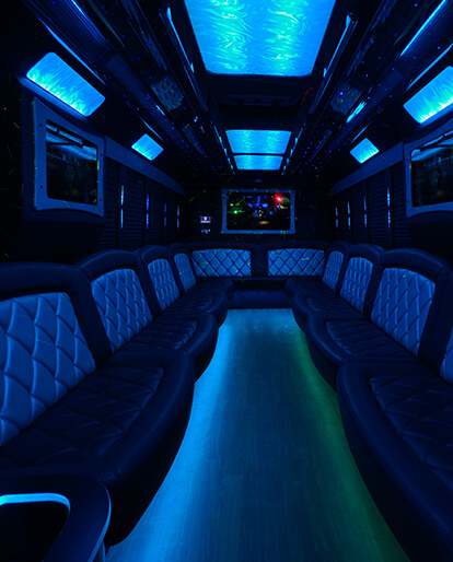 flat screen TVs in a limo bus